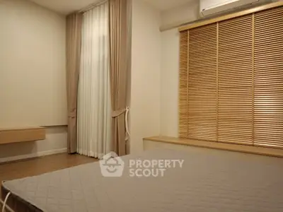 Cozy bedroom with modern decor and natural light