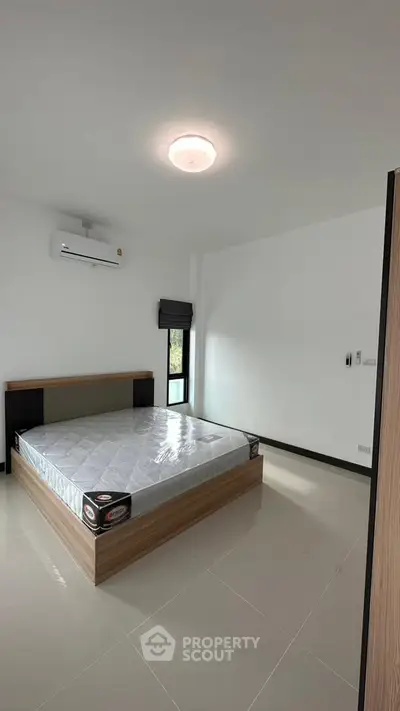 Modern minimalist bedroom with sleek design and natural light