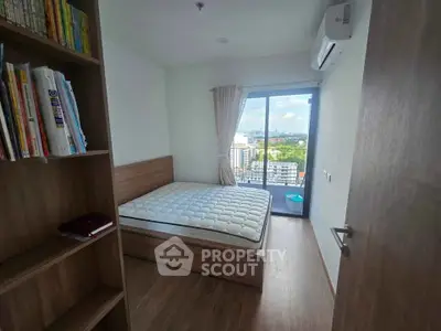 Modern bedroom with balcony view in high-rise apartment