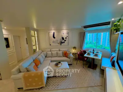 Luxurious living room with modern decor and large windows offering stunning city views.