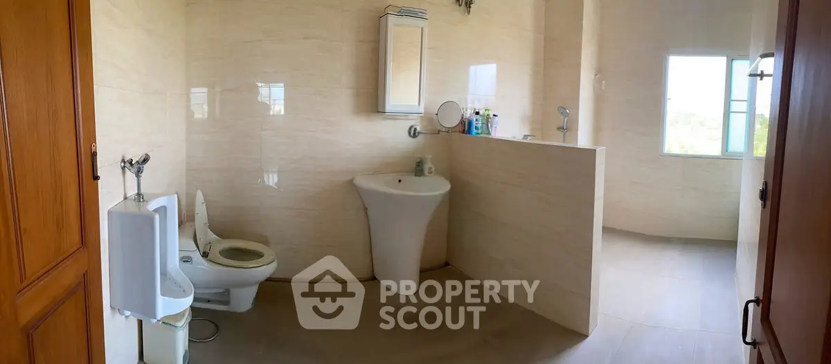 Spacious bathroom with modern fixtures and natural light