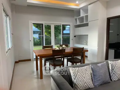 Modern living room with elegant dining area and garden view