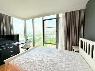 Modern bedroom with stunning city view and large windows