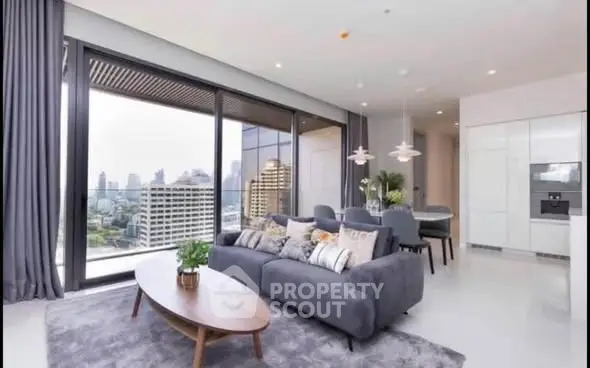 Luxurious modern living room with stunning city view and elegant decor
