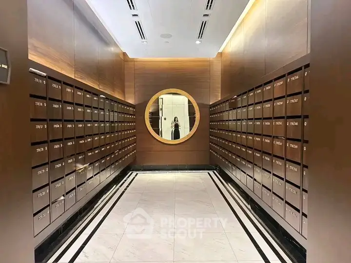 Luxurious apartment building mailroom with elegant wooden mailboxes and modern design.
