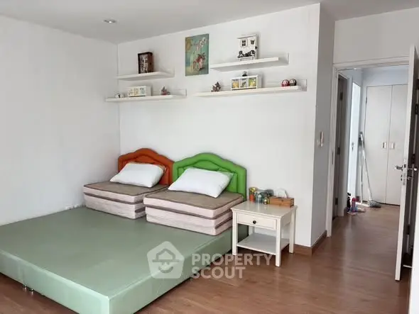 Spacious bedroom with twin beds and modern decor