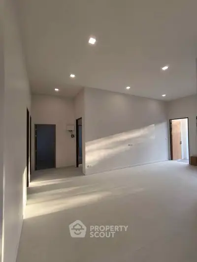 Spacious modern living room with high ceilings and natural light