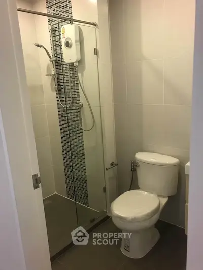 Modern bathroom with glass shower and sleek tile design