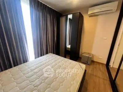 Cozy bedroom with modern air conditioning and ample natural light