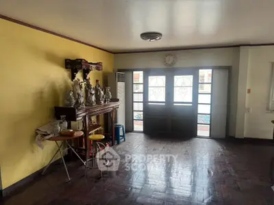 Spacious living room with wooden flooring and decorative elements