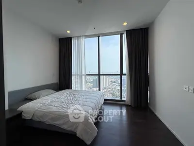 Spacious bedroom with stunning city view and modern minimalist design