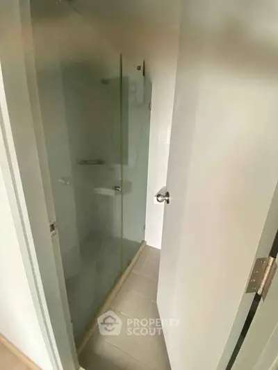 Modern bathroom with glass shower enclosure and sleek design