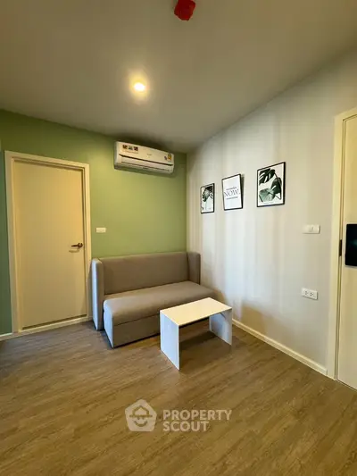 Modern living room with minimalist decor and air conditioning