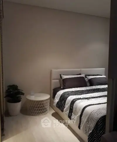 Cozy bedroom with modern decor and stylish bedding