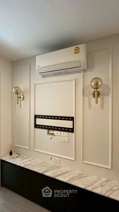 Elegant living room with air conditioning and stylish wall sconces