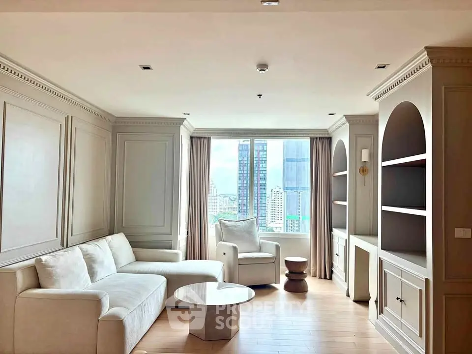 Elegant living room with modern furniture and city view through large window.