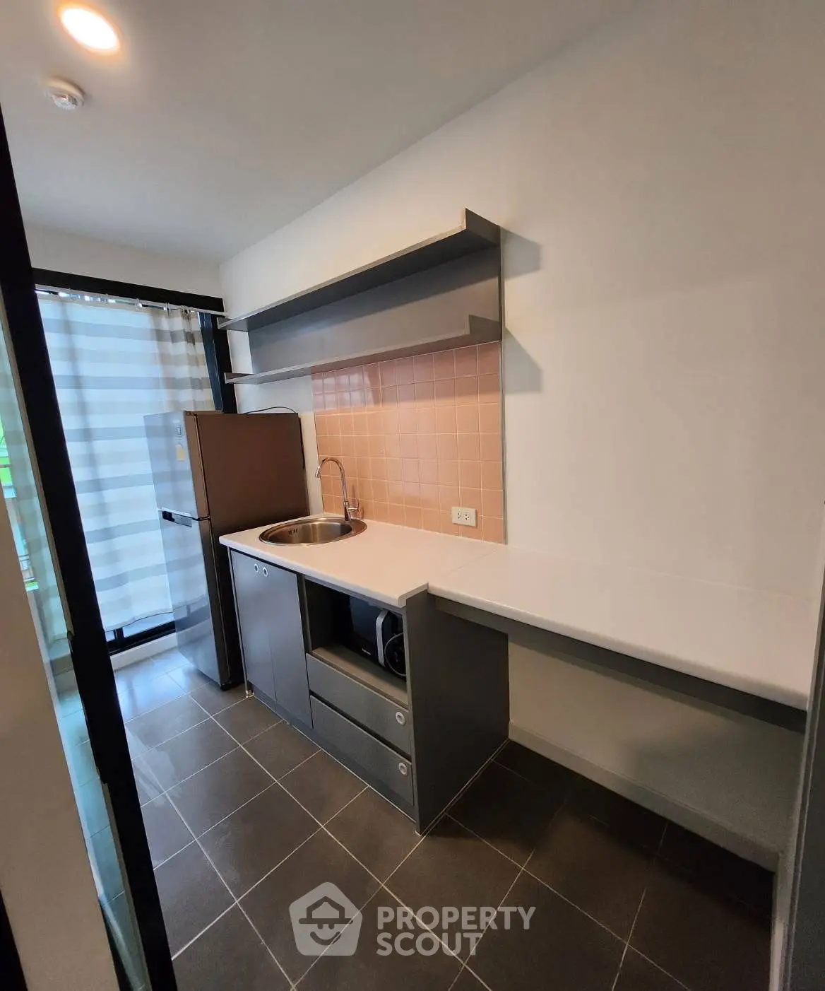 Modern kitchen with sleek cabinetry and stainless steel appliances