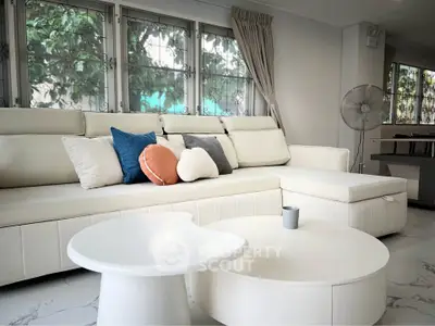 Luxurious modern living room with elegant white sofa and stylish decor