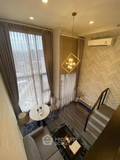 Luxurious modern living room with high ceilings and large windows offering stunning city views.
