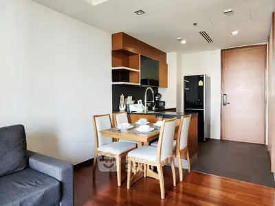 Modern open kitchen with dining area in stylish apartment