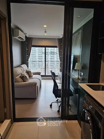 Modern living room with balcony view in high-rise apartment
