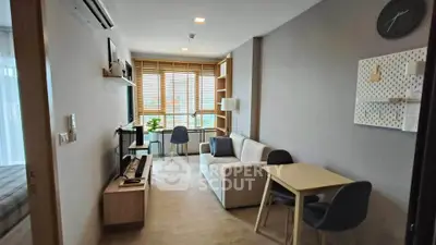 Modern living room with stylish furniture and natural light in a cozy apartment.