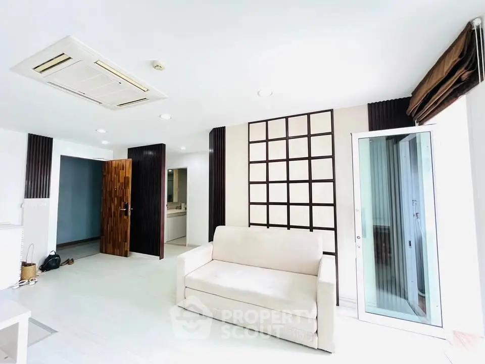 Spacious modern living room with elegant decor and natural light