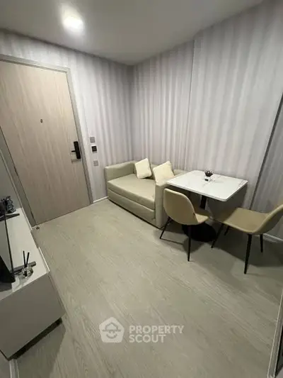 Modern compact living room with cozy sofa and dining area