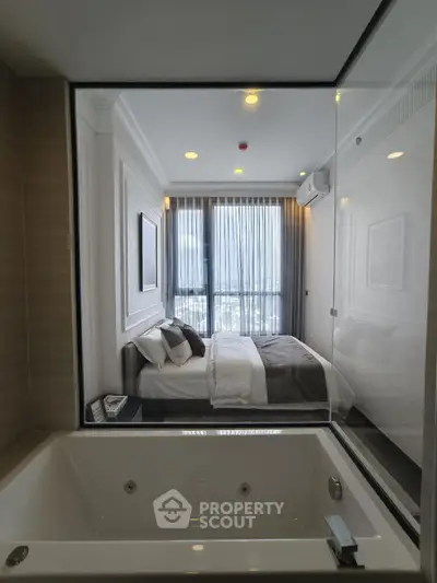 Luxurious bedroom with city view and modern bathtub in elegant apartment