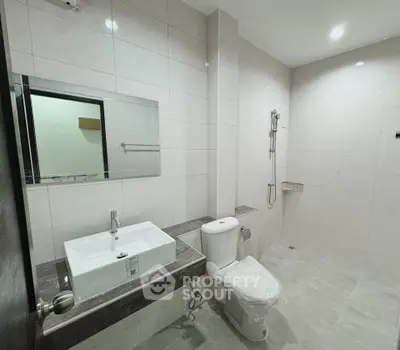 Modern bathroom with sleek fixtures and spacious design