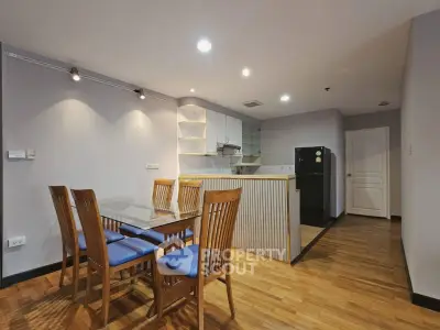 Spacious dining area with modern kitchen in open layout apartment