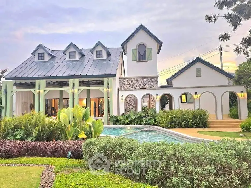 Charming modern house with lush garden and inviting pool, perfect for serene living.