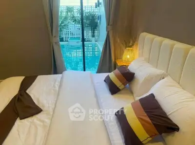 Cozy bedroom with pool view and elegant decor