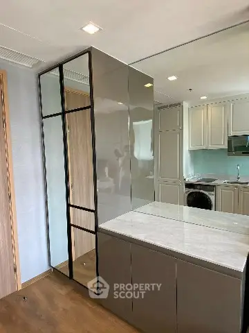 Modern kitchen with sleek cabinetry and integrated appliances