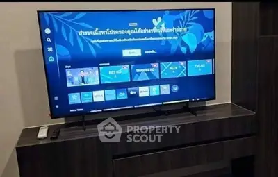 Modern living room with sleek TV unit and contemporary decor