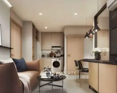 Modern open-plan living room with stylish kitchen and cozy seating area.