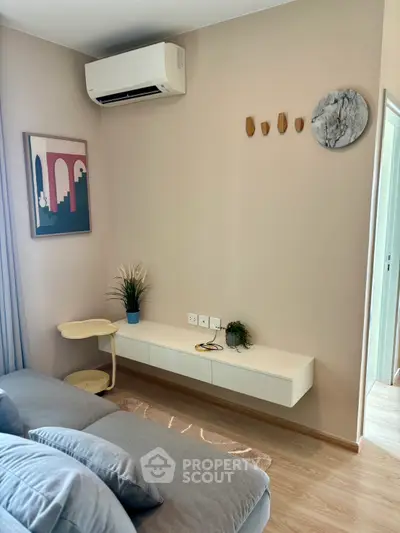 Modern living room with stylish decor and air conditioning unit