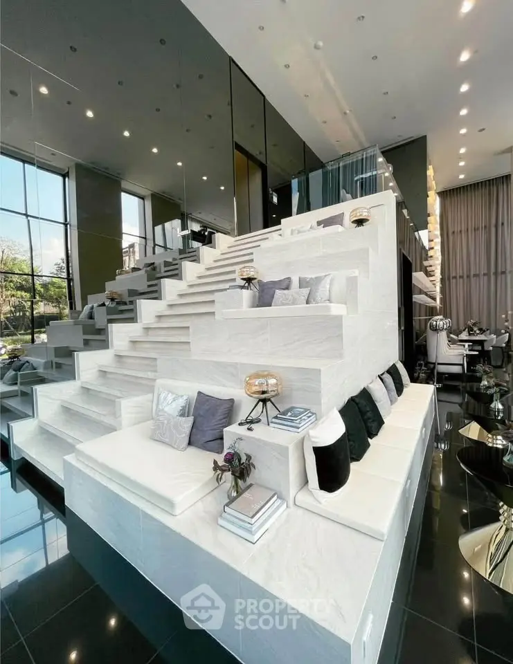 Luxurious modern living room with unique tiered seating and elegant decor