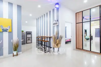 Modern open-plan living area with stylish decor and sleek furniture