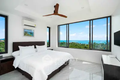 Luxurious bedroom with stunning ocean view and modern decor