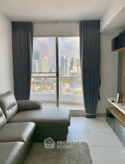 Modern living room with city view, featuring sleek furniture and large windows.