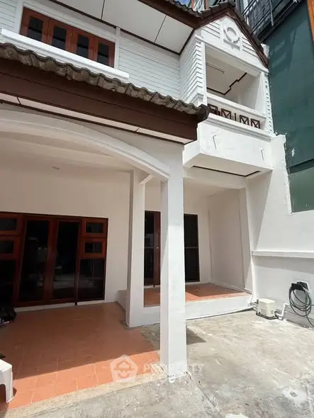 Charming two-story townhouse with spacious outdoor patio and modern design.