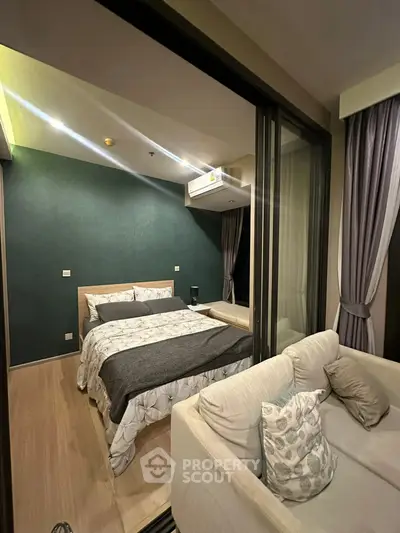 Modern bedroom with cozy balcony in stylish apartment