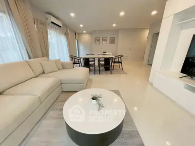 Spacious modern living room with elegant decor and ample natural light