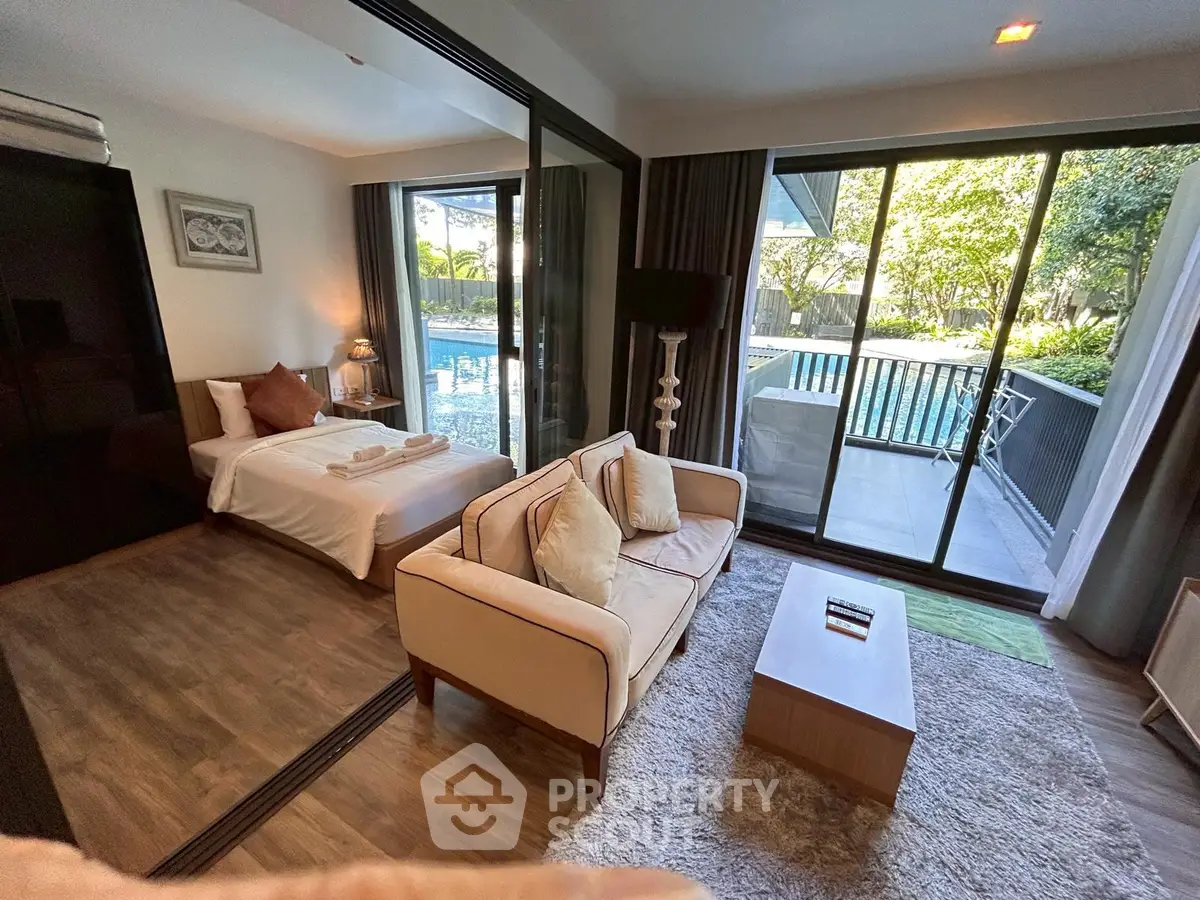 Luxurious studio apartment with pool view and modern furnishings