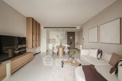 Modern open-layout living room with sleek furniture and neutral tones