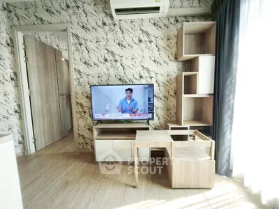 Modern living room with stylish furniture and wall design