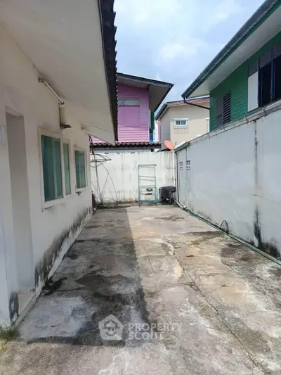 Spacious outdoor area with potential for renovation in suburban home