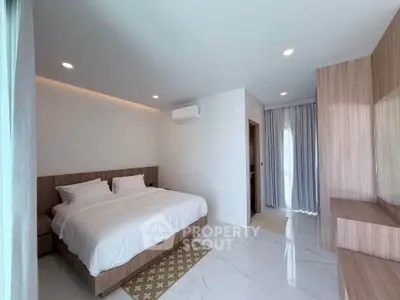 Spacious modern bedroom with elegant design and natural light