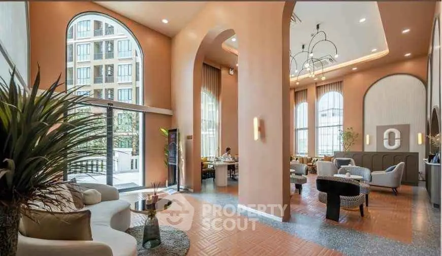 Luxurious high-ceiling living room with elegant decor and large windows